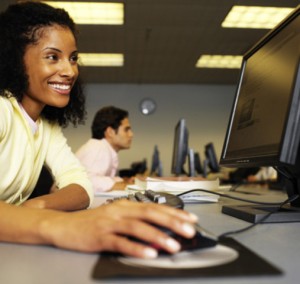 Woman on computer smiling