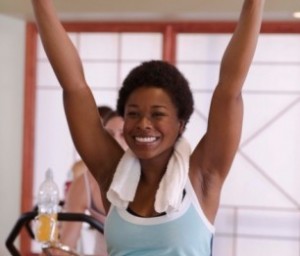 black woman on stationary bike