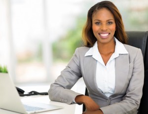 Young black professional woman sitting at a desk