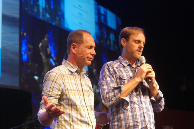 Praying with a mentor during the company launch