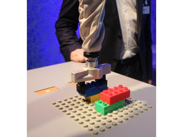 This robot can do intricate tasks such as stacking Legos. The operator uses a touchscreen to show the robot what to do. 