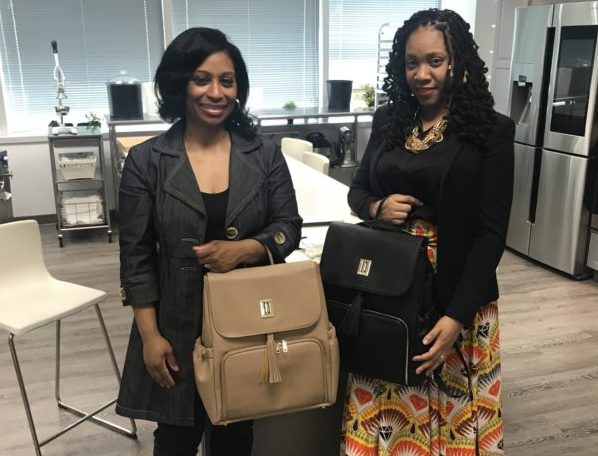 Sherrill Mosee and Tara Darnley with new diaper bag for parents and babies