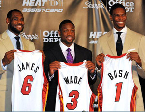 LeBron James, Dwayne Wade, Chris Bosh holding Miami Heat jerseys