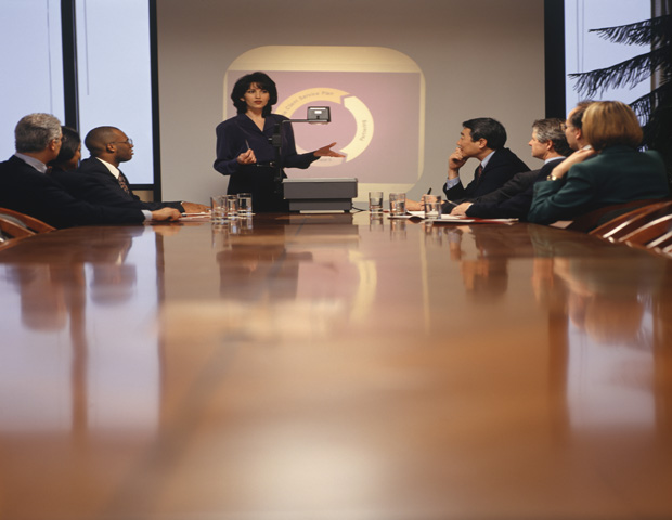 giving presentation Businesswoman giving presentation in boardroom