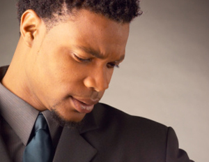 black_business_man_looking_at_watch