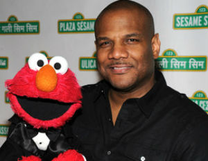 kevin clash smiling holding elmo