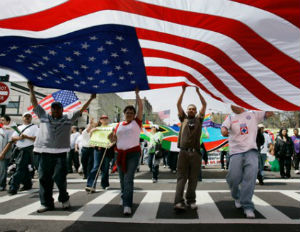 immigrants holding usa flag