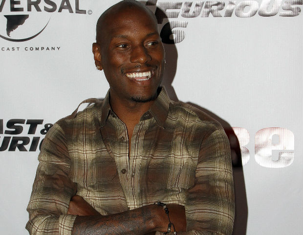 Tyrese smiles for the media