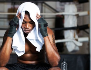 Black man thinking at the gym