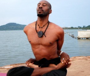 Black Yogi Pablo Imani in full lotus pose