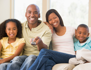 Black family in front of the TV