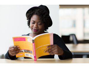 Woman studying tech book