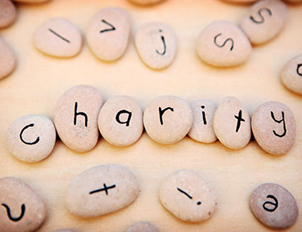 Image of stones that spell out charity