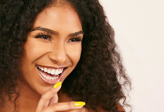 Black Woman With Yellow Nails