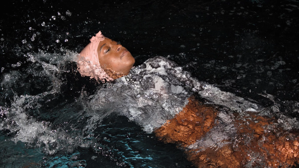 Danielle Obe swimming her Nemes swim cap