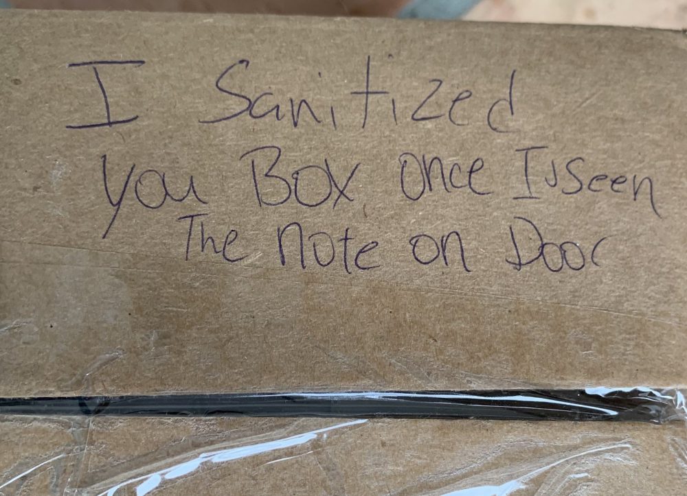 FedEx worker sanitizes package