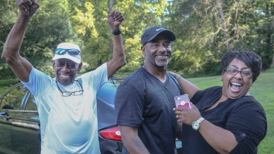 Chester Holman III with his father and sister