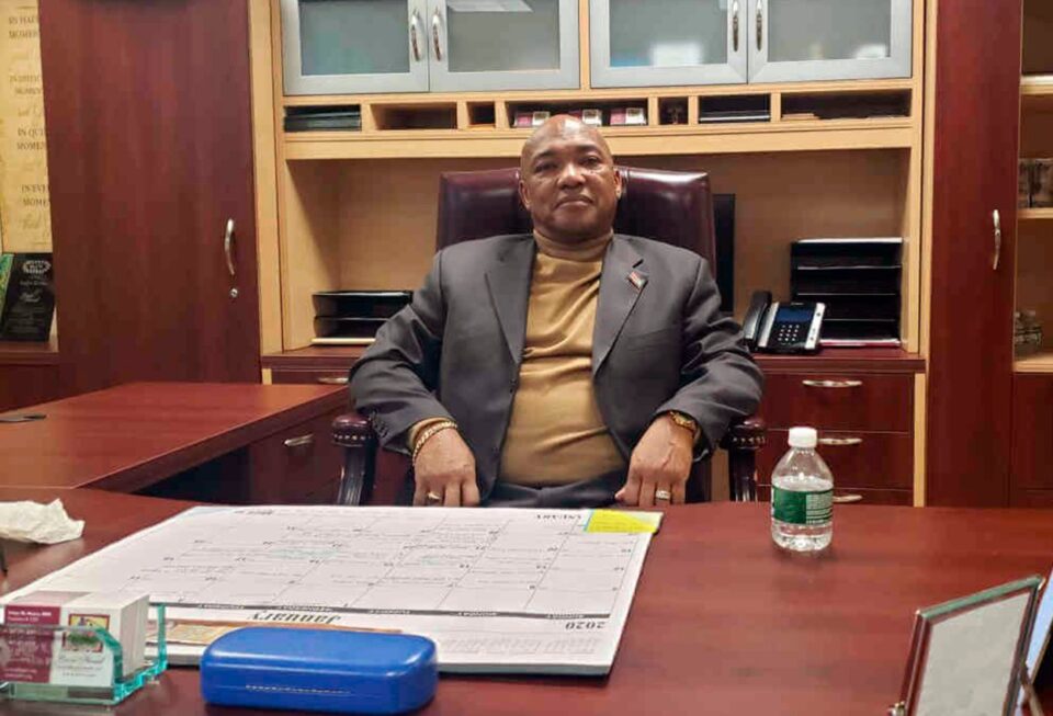 Victor Rivera sitting at a desk