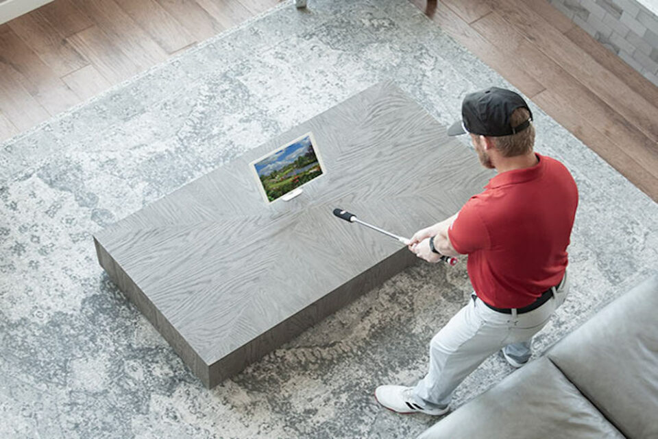 man playing golf simulation