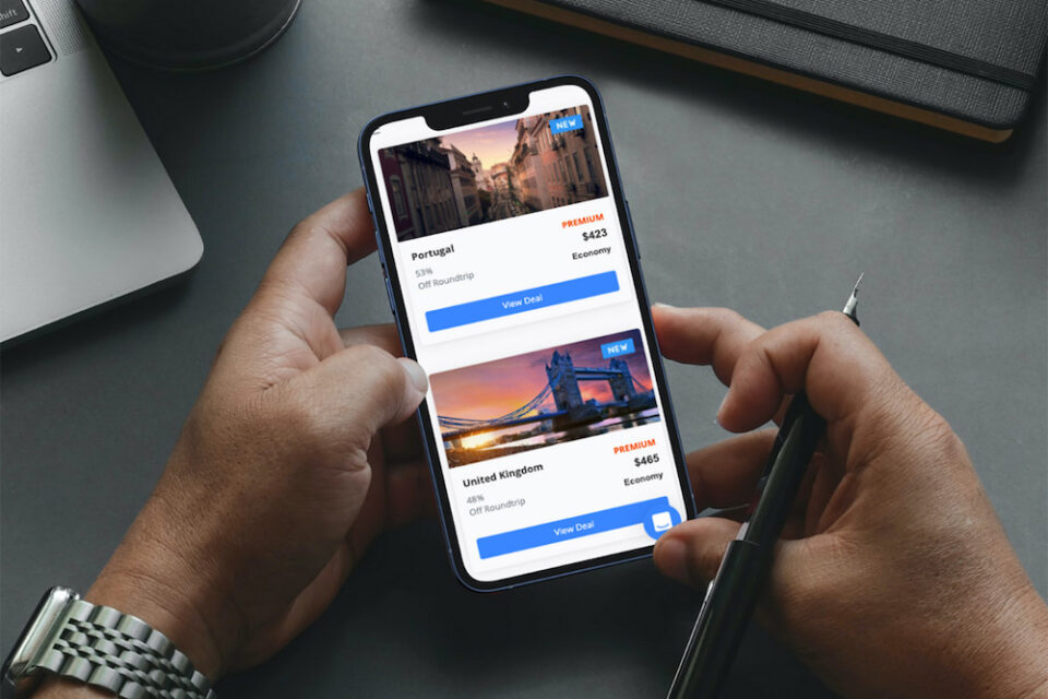 hands holding phone with deals