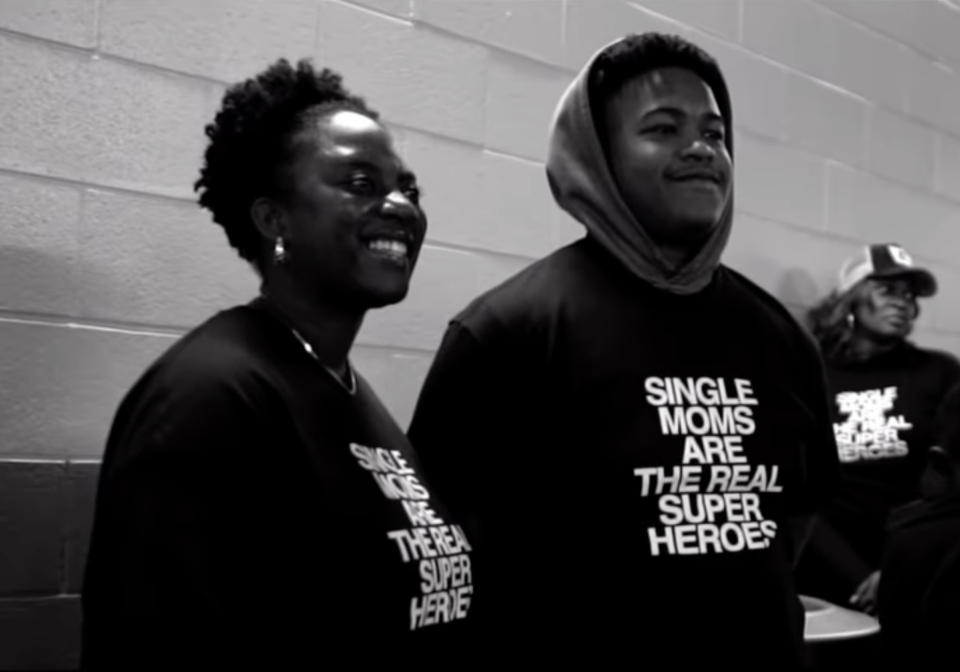 Family takes photo during Atlanta Falcon and Pittsburgh Steelers game
