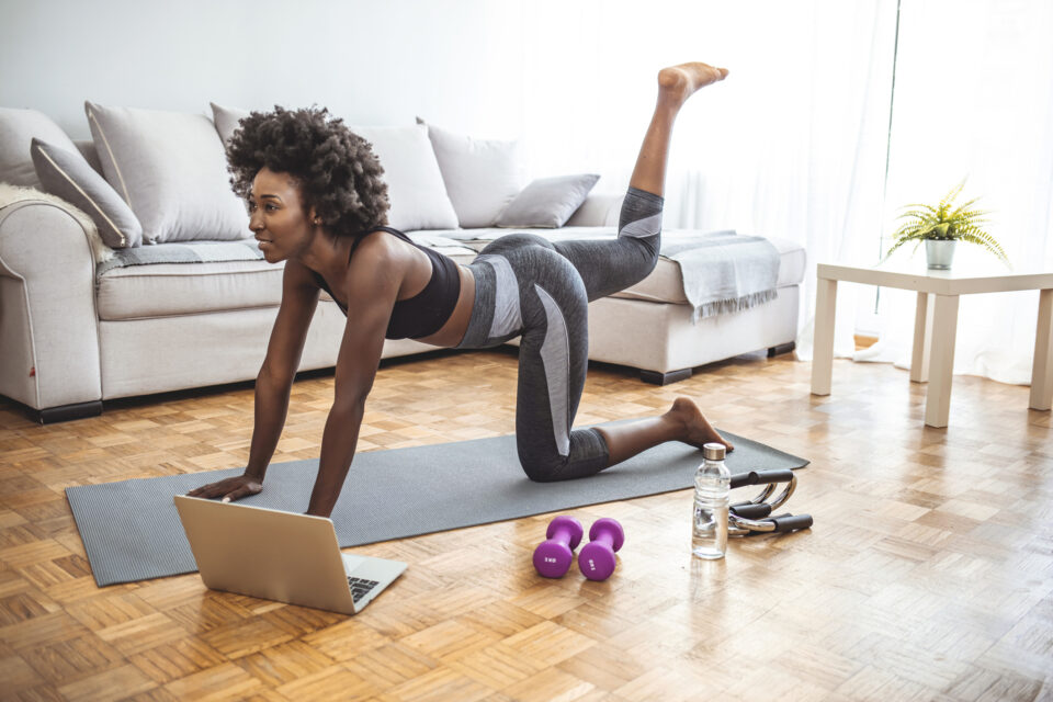 Woman working out in her home