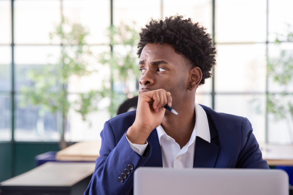 Portrait of thoughtful male office worker