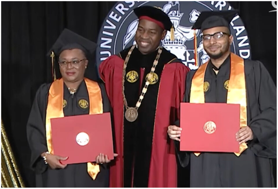 Carolyn and Immanuel Patton hold their diplomas