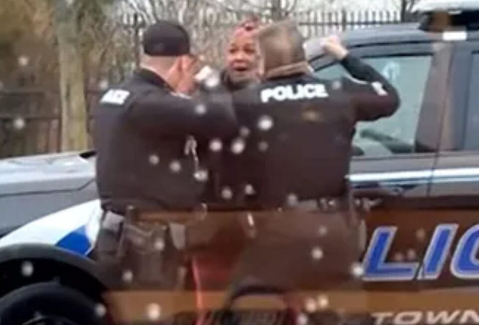 Disturbing picture of Black woman being punched by police