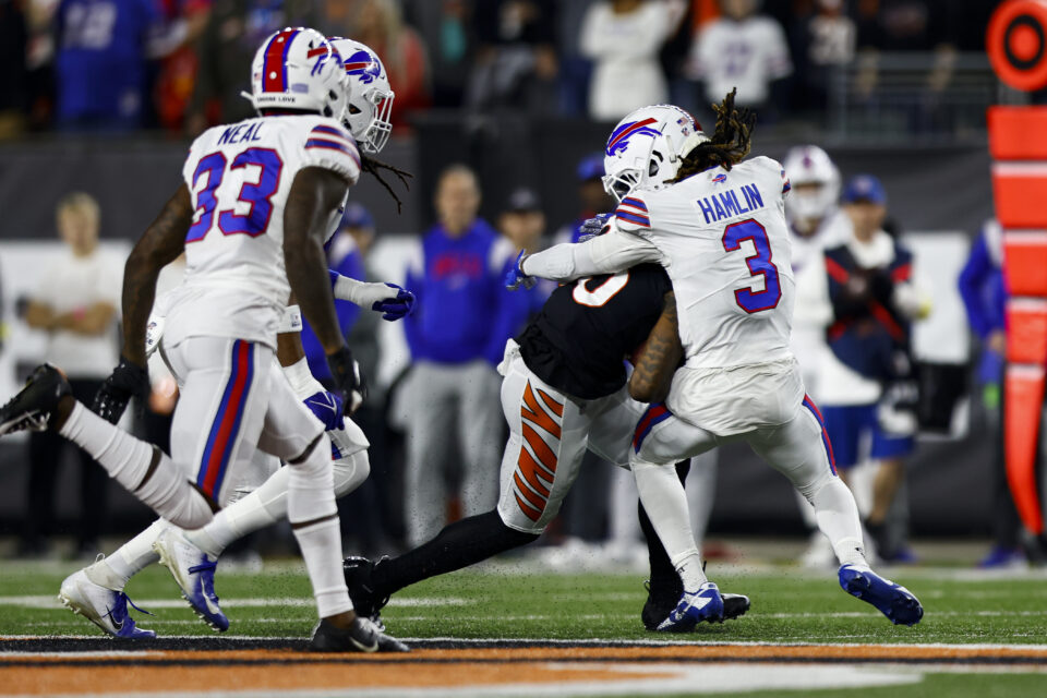 Damar Hamlin #3 of the Buffalo Bills tackles Tee Higgins #85 of the Cincinnati Bengals during the first quarter of an NFL football game