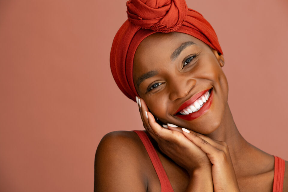 Beautiful stylish african woman smiling at camera