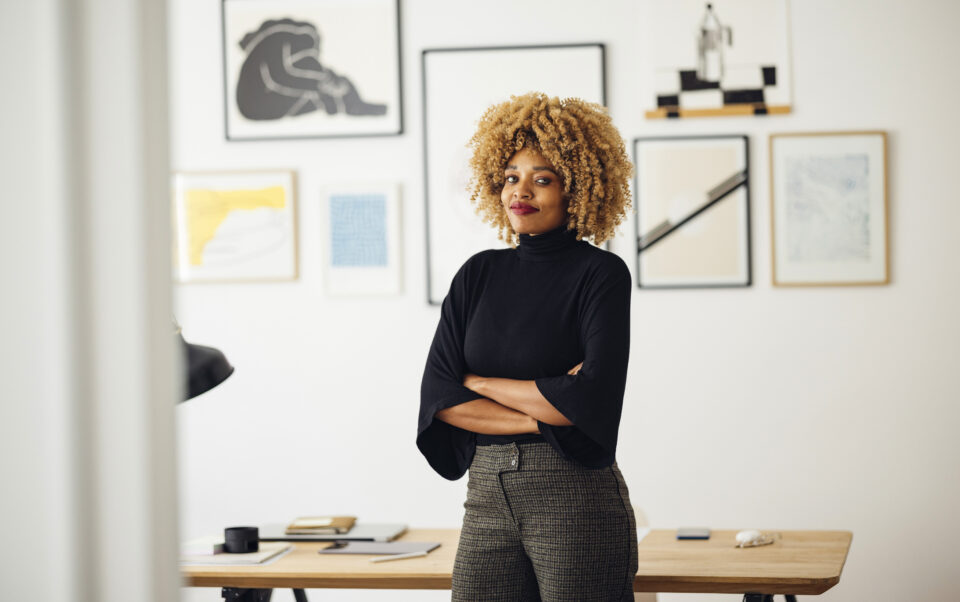 Entrepreneur standing in her home office