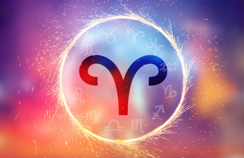 Aries symbol on a colorful background